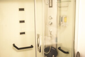 Shower, hair dryer, towels, soap