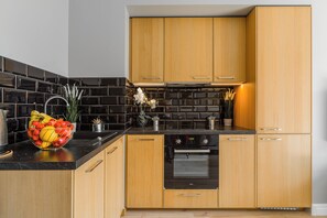 Deluxe Apartment | Private kitchen | Fridge, oven, stovetop, dishwasher