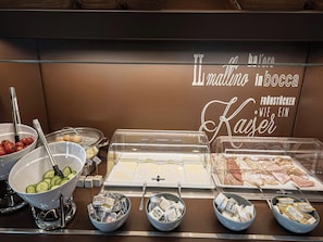 A buffet with various food items including fruits, vegetables, and dairy products. - B&B Hotel Wiener-neudorf (Wiener Neudorf)