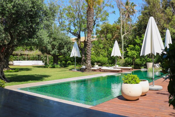 Outdoor pool, pool umbrellas, pool loungers