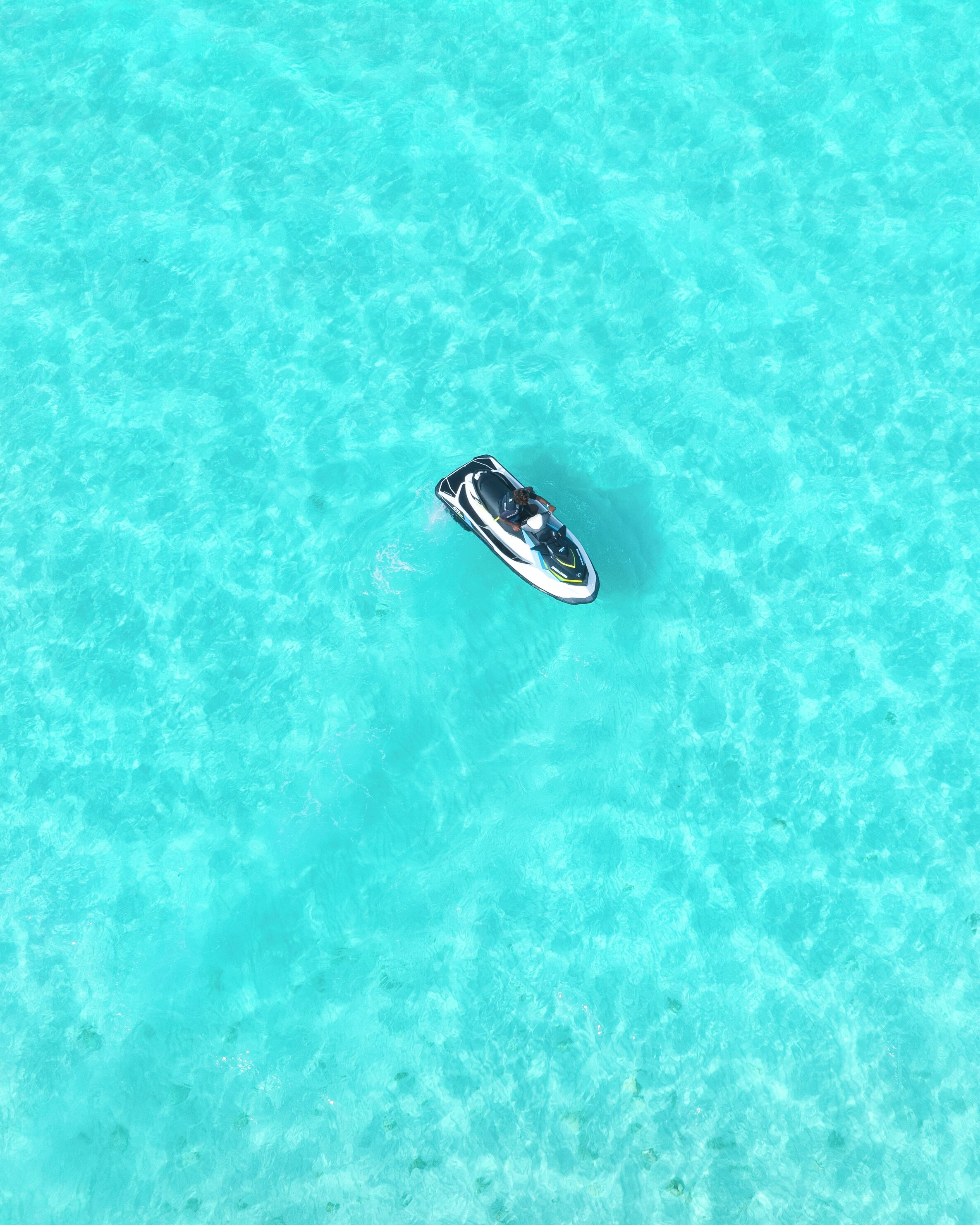 A jet ski on clear turquoise water.