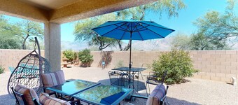 Dog-friendly desert home with mountain views, enclosed yard, grill, W/D, and AC
