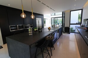 Villa | Private kitchen | Full-size fridge, microwave, oven, stovetop - Luxurious Coastal Villa w Pool & Garden (Herzliya)
