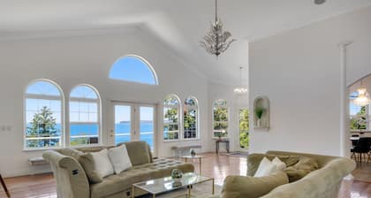 Luxurious dog-friendly bay-view home with private beach access