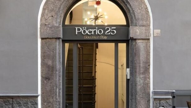 An entrance to a building with a sign reading "Pöerio 25 Collection Stay". - Poerio 25 Boutique Stay (Naples)