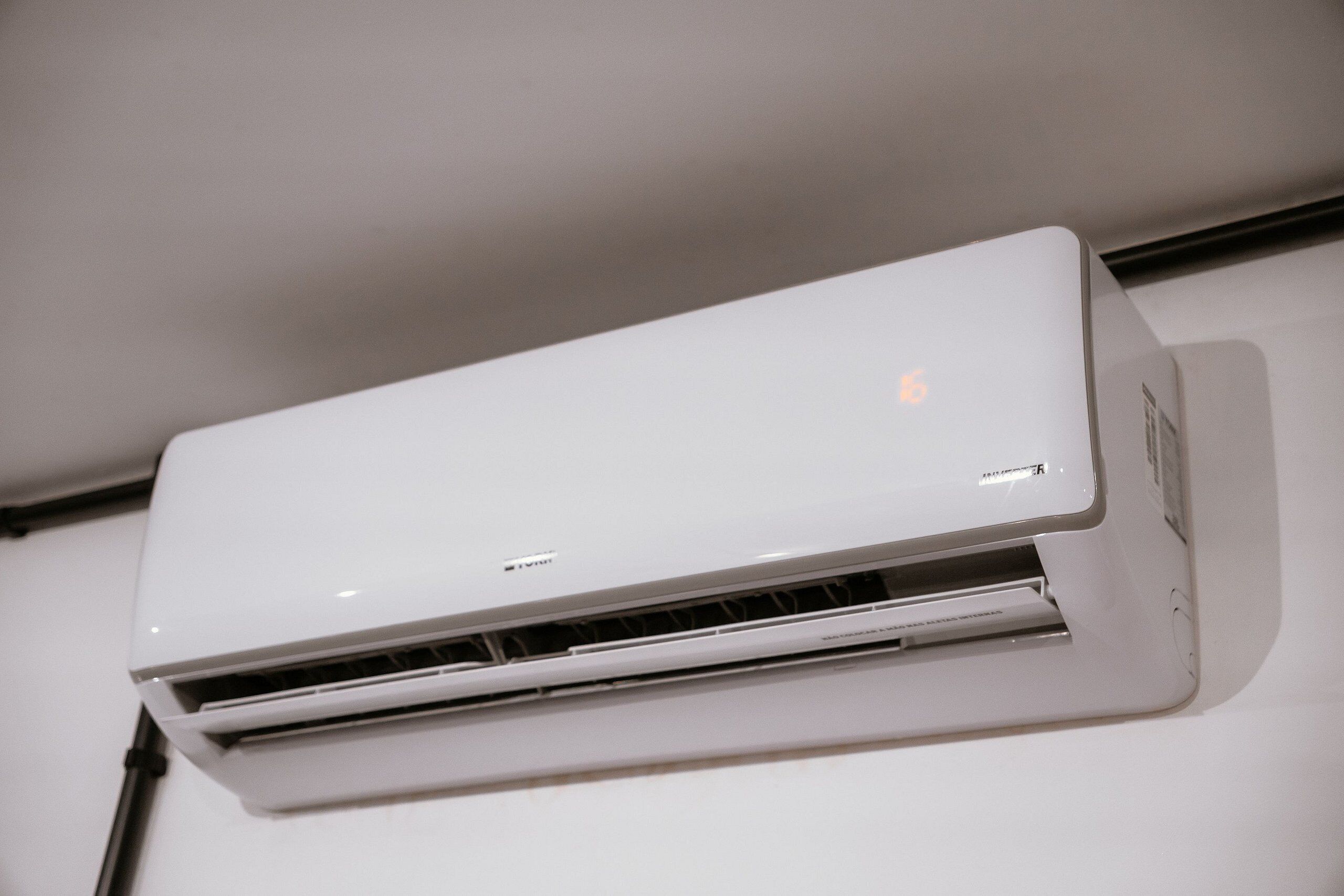 A white air conditioning unit mounted on a wall.