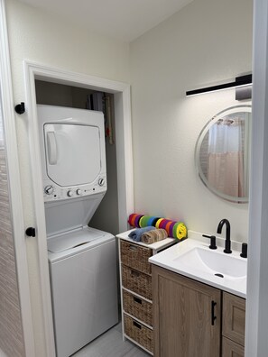 Shower, hair dryer, towels, soap