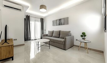 Superior Apartment | Living area | Flat-screen TV
