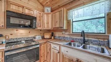 Cabin, Multiple Beds, Hot Tub (682 Old Comfort Opal) | Private kitchen | Coffee/tea maker