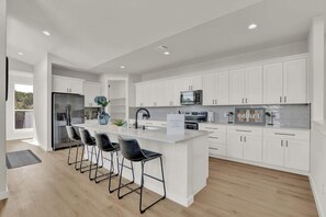 House, Multiple Beds, Pool Access (502 Venture Blvd S) | Private kitchen | Coffee/tea maker, electric kettle