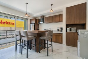 Fridge, microwave, stovetop, coffee/tea maker