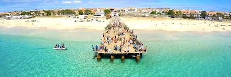 Beach nearby, white sand, beach towels, beach bar. Hotel Central Santa Maria