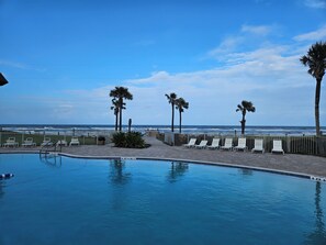 Outdoor pool, a heated pool - Bridget's Beach Retreat, On the beach with views on balcony,bedroom,living room (New Smyrna Beach)