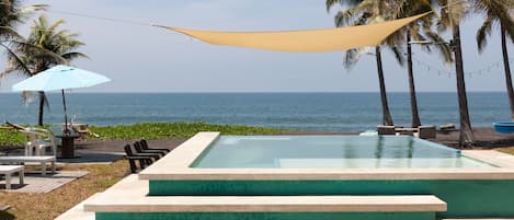 Outdoor pool, open 7:00 AM to 9:00 PM, pool umbrellas, sun loungers