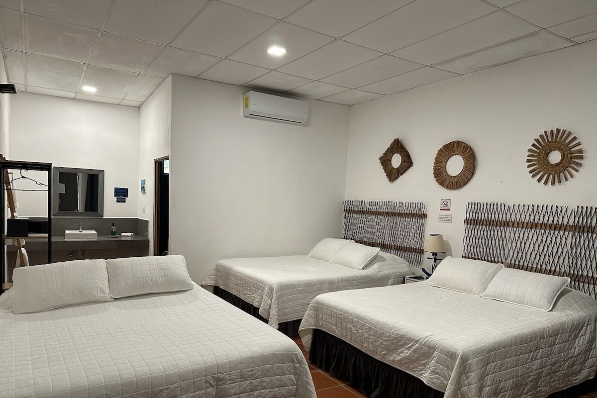 Family Double Room, Multiple Beds, Private Bathroom, Beach View | Down duvets, in-room safe, blackout curtains, free WiFi