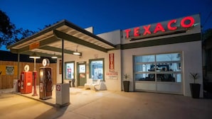 A Texaco gas station with a canopy, fuel pumps, and a visible store entrance. - Kerrville Texaco
 (Kerrville)
