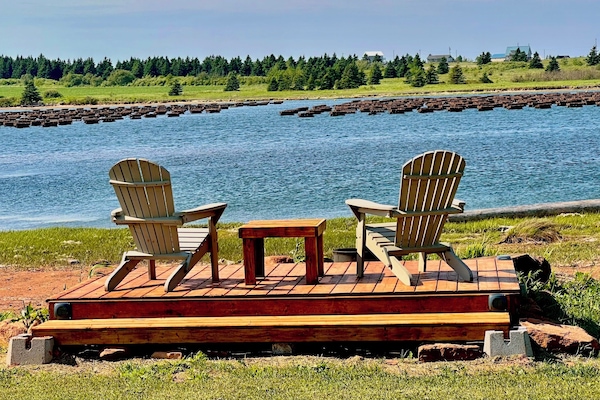 Deck and sitting area, by the water and beach