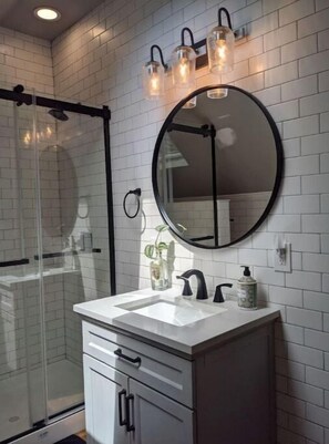 Shower, hair dryer, towels, soap