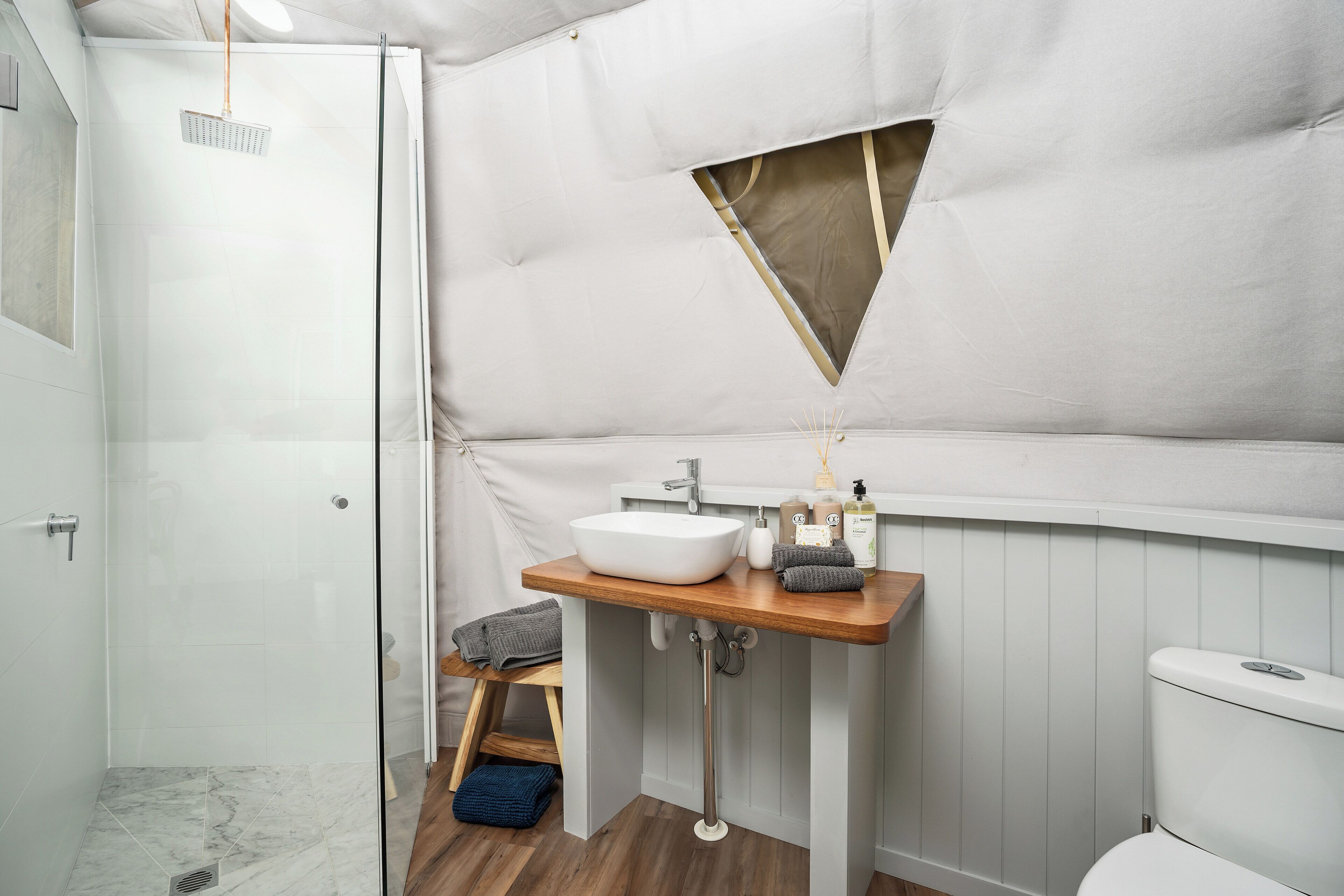 Shower, rainfall showerhead, eco-friendly toiletries, towels