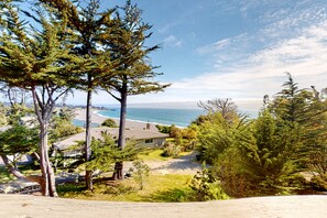 Enjoy ocean views from this scenic property, surrounded by a well-maintained lawn and mature trees.