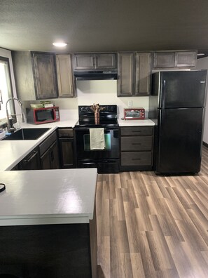 Fridge, microwave, oven, stovetop - Furnished 2BR Near NAS, Hospitals & Beach - Sleeps 4, Parking Included (Pensacola)