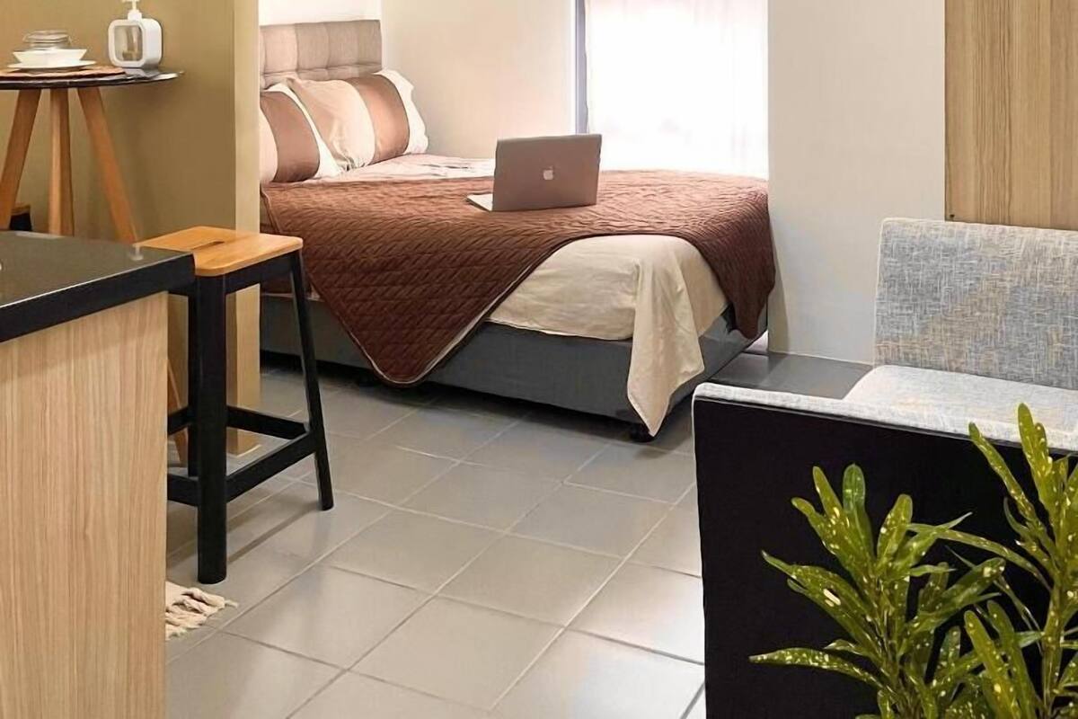 Hypo-allergenic bedding, desk, laptop workspace