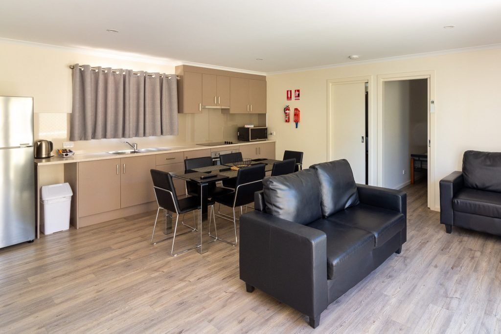 Deluxe 3 Bedroom Cabin 19 | Private kitchen | Full-sized fridge, microwave, electric kettle, cleaning supplies