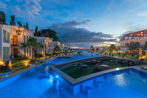 4 outdoor pools, open 9:00 AM to 10:00 PM, pool umbrellas, sun loungers