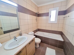 Comfort Apartment | Bathroom | Deep-soaking bathtub, towels - Heaven in Yair's MPV Apartment (Mazotos)