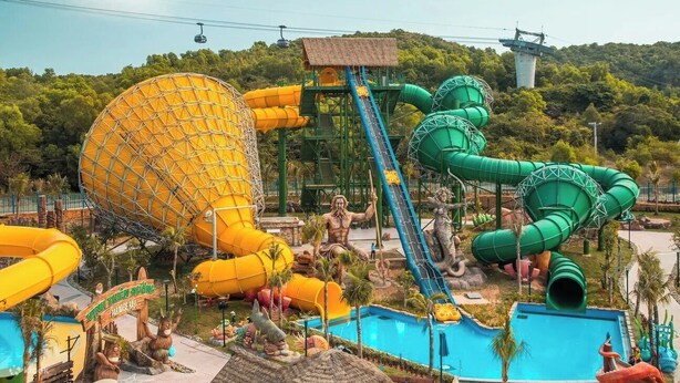 A water park with large slides and a pool area. - Lotus Home Hillside (Phu Quoc)