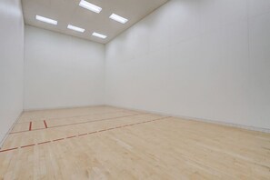 A room with a wooden floor, white walls, and ceiling lights. - Grace-Jo @ Tamarack Highland 5 (Wisconsin Dells)