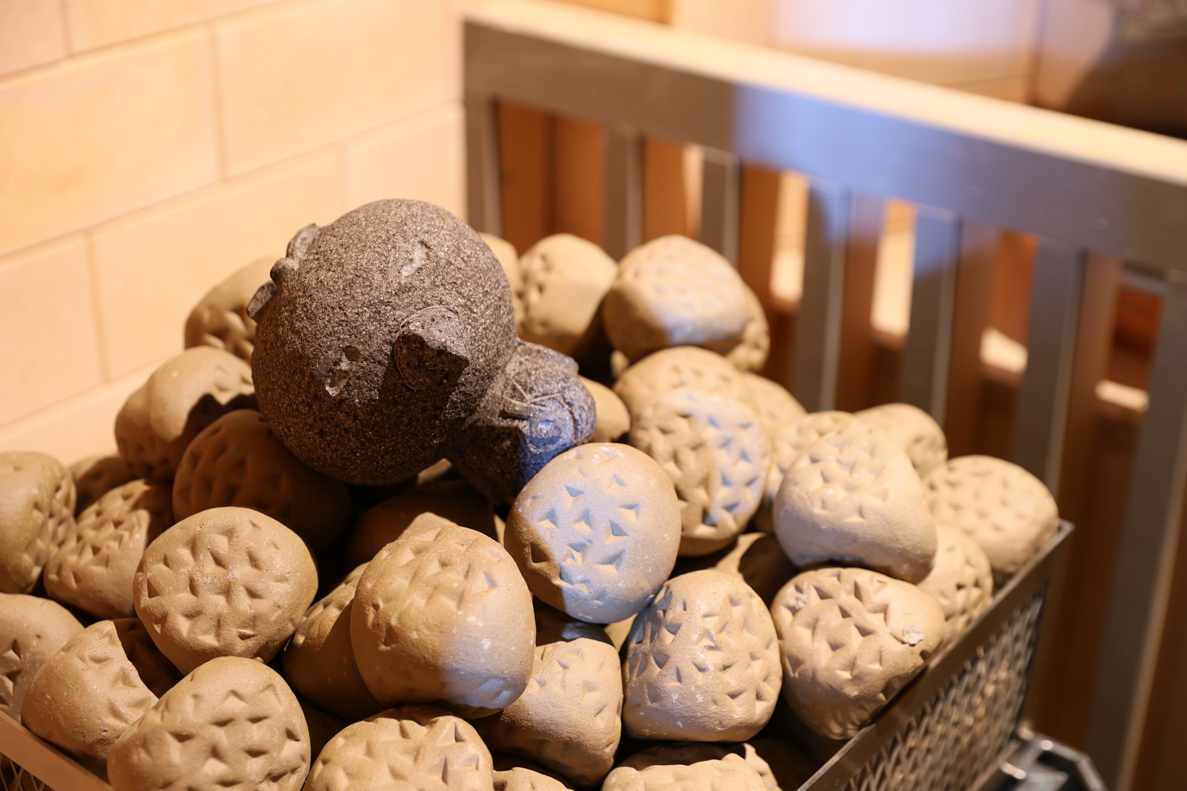A basket filled with variously shaped cookies.