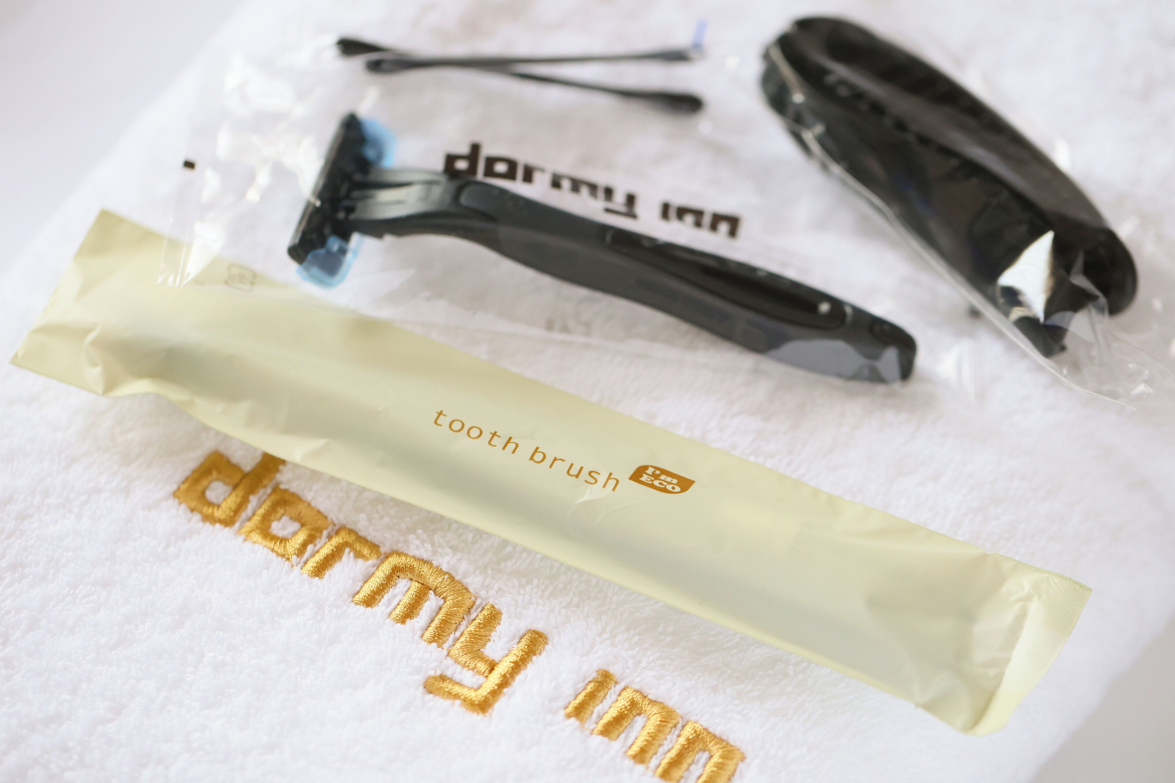 A package labeled 'darmy inn' and a tooth brush.