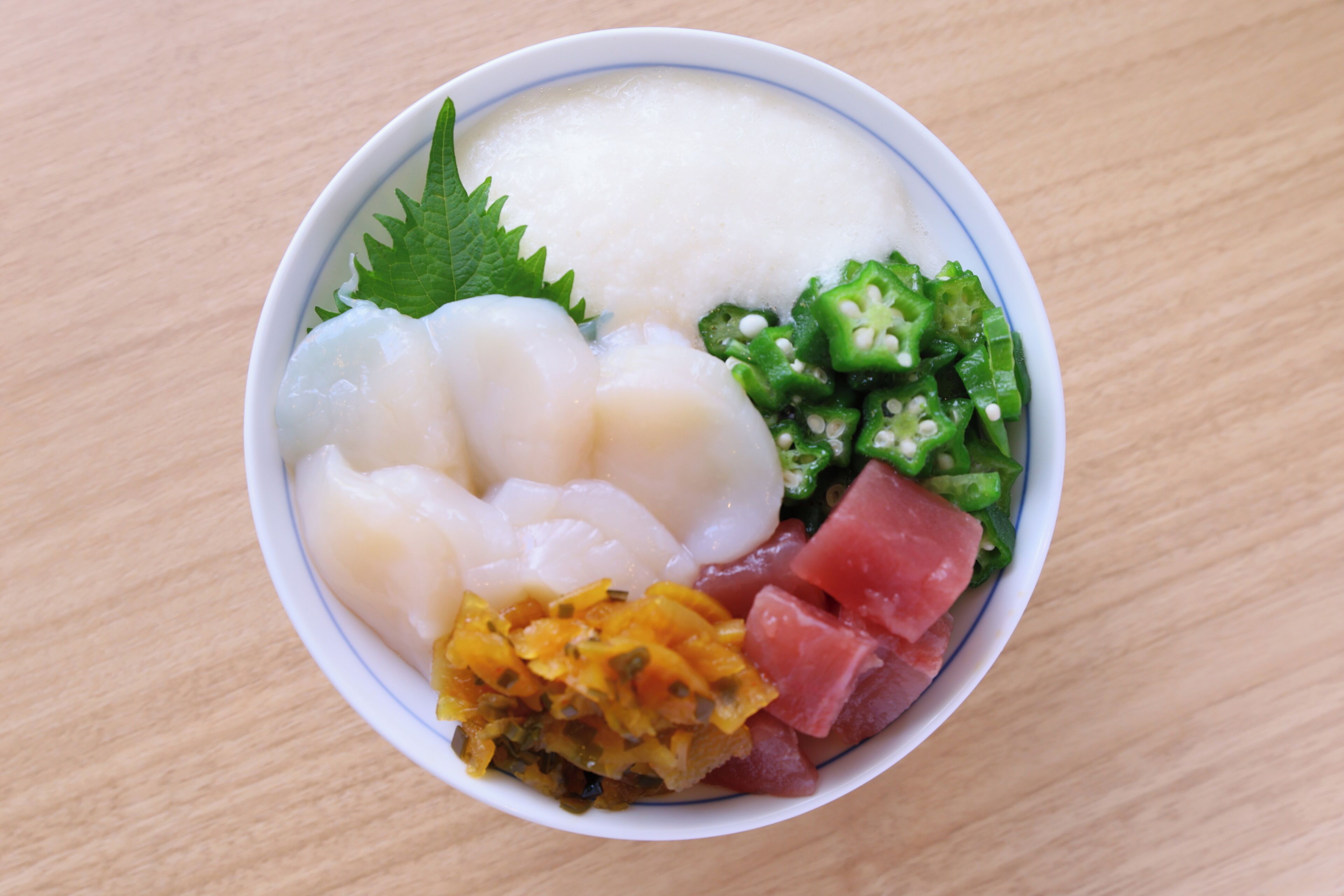 A bowl of food with various ingredients.