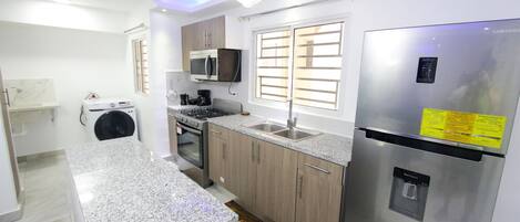 Fridge, microwave, coffee/tea maker, toaster