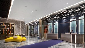 A modern lobby with a reception desk, seating area, and bookshelves. - Shenzhen Naive S Hotel (Xili Metro Station Store) (Shenzhen)
