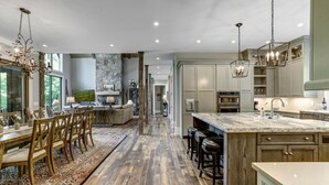 A spacious kitchen with a large island, wooden flooring, and modern cabinetry. - Nearly Six Private Acres. A Spring-Fed Trout Pond. Shortoff MountainViews | Shortoff Mountain View (Highlands)