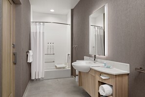 A modern bathroom with a shower, a sink, and a mirror. - Springhill Suites By Marriott Kalamazoo Portage (Portage)