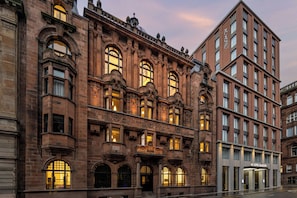 A historic building with ornate architectural details, including arched windows and decorative stonework. - AC Hotel by Marriott Glasgow (Glasgow)
