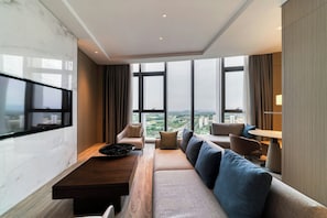 Suite, 1 Bedroom, City View | Living room | 55-inch flat-screen TV with cable channels