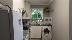 Apartamento executivo | Cozinha privada | Chaleira elétrica, torradeira