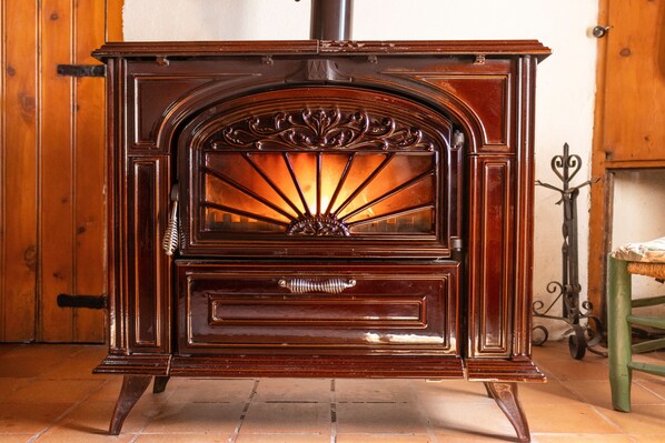 A vintage wooden stove with a decorative front panel and a single door. - Holiday Home "Cal Barral" with Mountain View, Balcony & Wi-Fi (Ansovell)