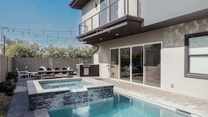 A modern two-story house with a swimming pool, outdoor seating, and a barbecue area. - Lavish Luxuries-Pool/Spa, Games, Walk To Old Town! (Scottsdale)