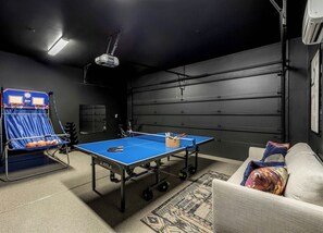 Extra seating and sleeping option with a pullout couch. Ping pong, hot shot, and workout equipment with a mirror. - Lavish Luxuries-Pool/Spa, Games, Walk To Old Town! (Scottsdale)