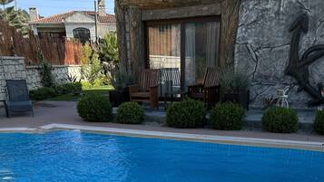Outdoor pool, open 9:00 AM to 11:30 PM, pool umbrellas, sun loungers