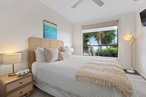 Comfortable queen bedroom with soft coastal styling. - Valley View Home | Sauna, Fire Pit, Pizza Oven (Port Lincoln)