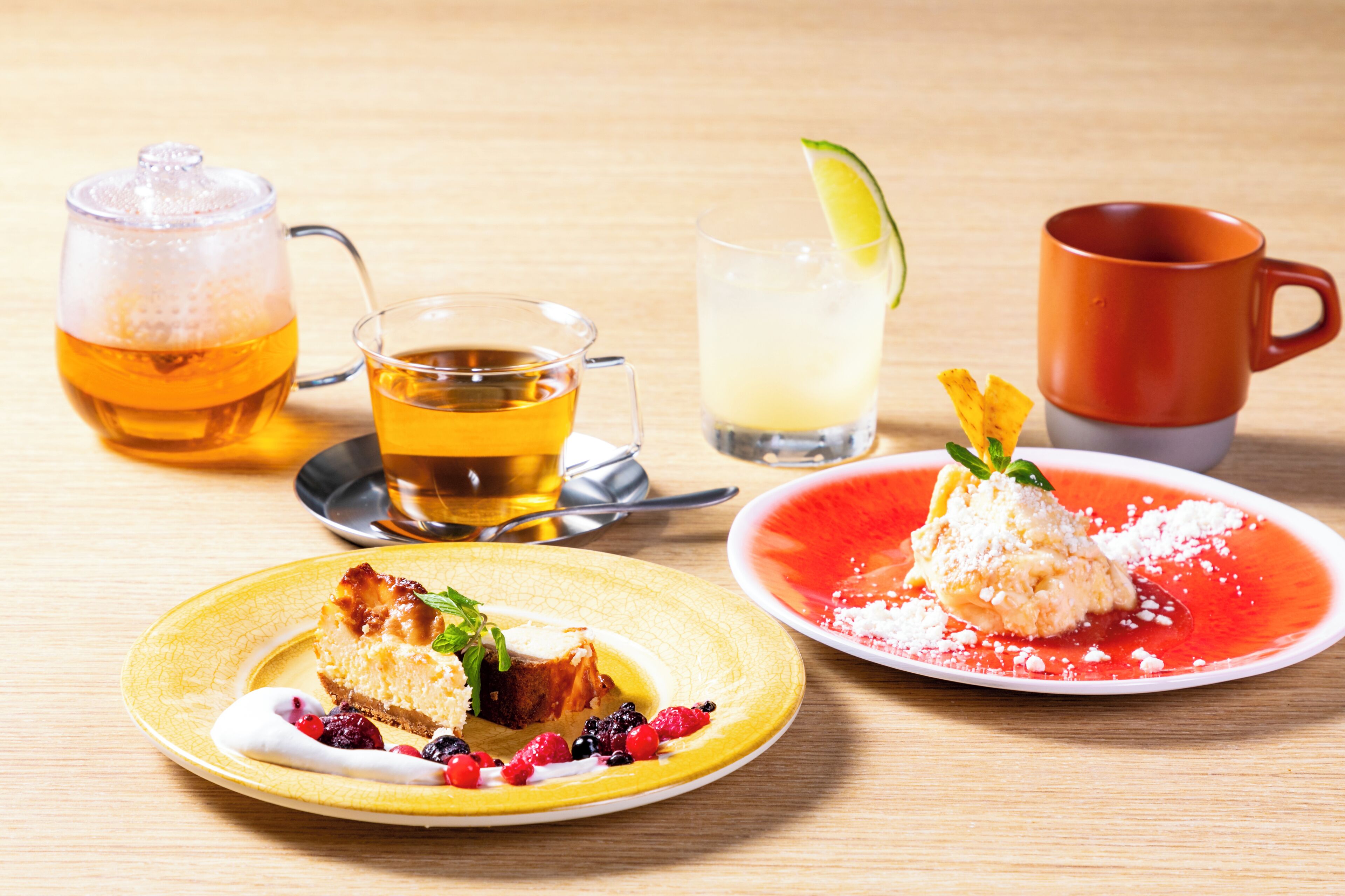 A table with a variety of drinks and desserts.