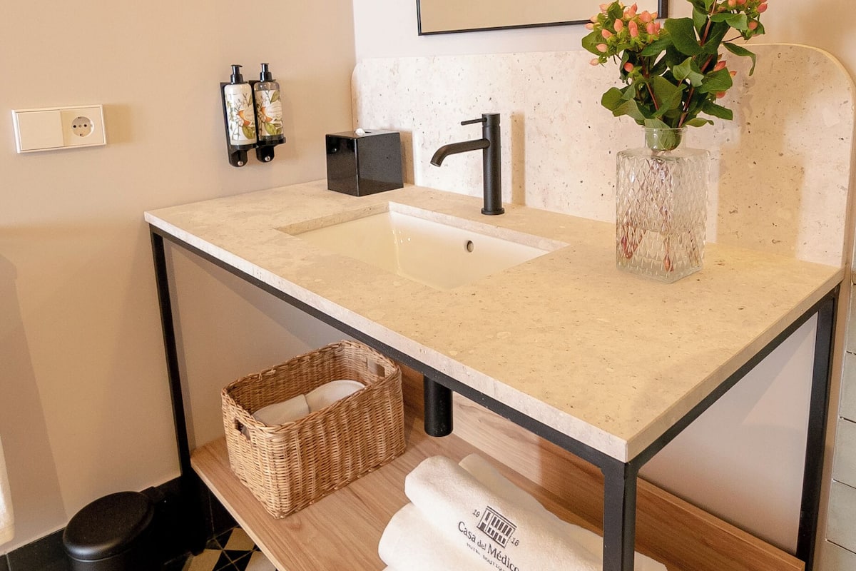 Shower, rainfall showerhead, designer toiletries, hair dryer