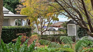 A residential area with a house, a gazebo, and a view of the ocean. - Anembo Hideaway - Relaxing Oasis (Kiama Heights)