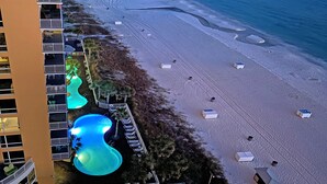 An aerial view of a hotel with a pool area, beach access, and a building with balconies. - Splash 906E -Master on Gulf-Free Golf & Activities Daily! (Panama City Beach)